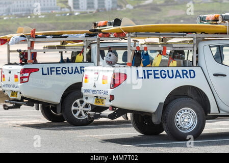 Two RNLI Lifeguard vehicles parked at Fistral in Newquay in Cornwall. Stock Photo