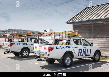 Two RNLI Lifeguard vehicles parked at Fistral in Newquay in Cornwall. Stock Photo