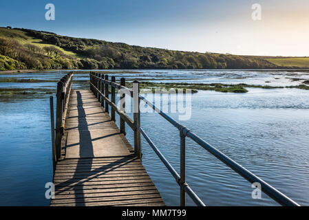 A wooden footbridge over the Gannel River in Newquay Cornwall. Stock Photo
