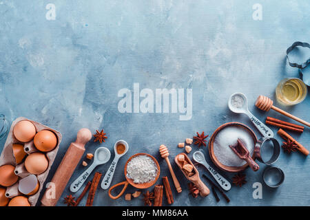 Cooking Tools And Ingredients From Above. Baking Concept With Measuring  Spoons, Wooden Scoops, Whisks, Cookie Cutters, Sugar, Flour, Eggs And  Cinnamon On A Modern Concrete Background With Copy Space Stock Photo,  Picture