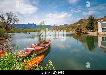 Neglected empty fisherman boats on the shore of lake Skadar in Virpazar, Montenegro Stock Photo