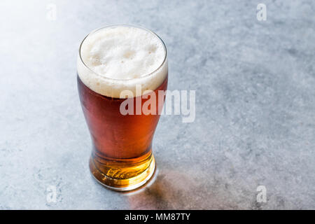 Cool Refreshing Red Amber Beer in Glass. Beverage Concept. Stock Photo