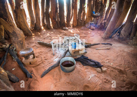 Interior of hut with burnt out campfire in the middle of it, Mukuni Village, Zambia Stock Photo