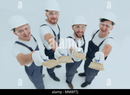 team of construction workers looking at the camera.isolated on white.photo with copy space Stock Photo