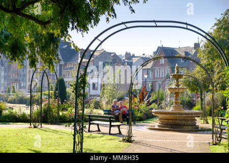 Le Jardin Public with couple in garden, Honfleur, Normandy, France, Europe Stock Photo