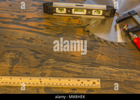 saw blade and other tools on wood Stock Photo