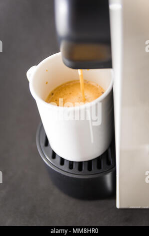 Coffee maker serving coffee, espresso, coffee pod. Stock Photo
