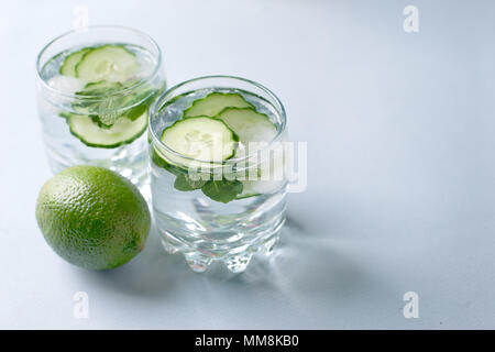 Detox water infused with sliced cucumber and springs of mint, copy space Stock Photo