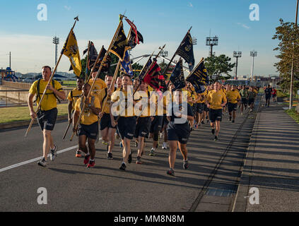 170913-N-OB360-004  YOKOSUKA, Japan (Sept. 13, 2017) Chief petty officers and chief petty officer selectees from Yokosuka area commands take part in a formation run with Master Chief Petty Officer of the Navy Steven S. Giordano at Fleet Activities Yokosuka. In addition to the run, Giordano had lunch with Sailors at the base galley and held an all-hands call. (U.S. Navy photo by Chief Mass Communication Specialist Ben Farone/Released) Stock Photo