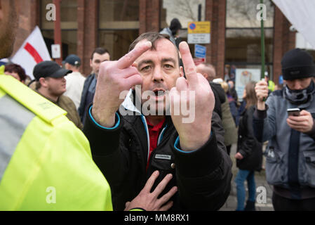 Walsall, West Midlands, UK. 7th April 2018. Pictured:  EDL supporters exchange words with opposing anti-fascist supporters in the town centre. / Up to Stock Photo