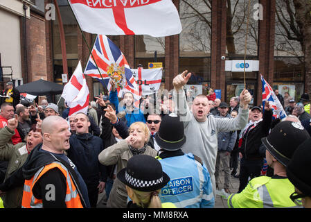 Walsall, West Midlands, UK. 7th April 2018. Pictured:  EDL supporters exchange words with opposing anti-fascist supporters in the town centre. / Up to Stock Photo