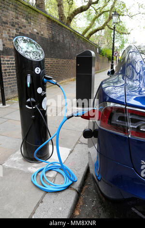 Vertical view of an electric car vehicle charging at a charging station EV charging point near Lincolns Inn in the City of London UK   KATHY DEWITT Stock Photo