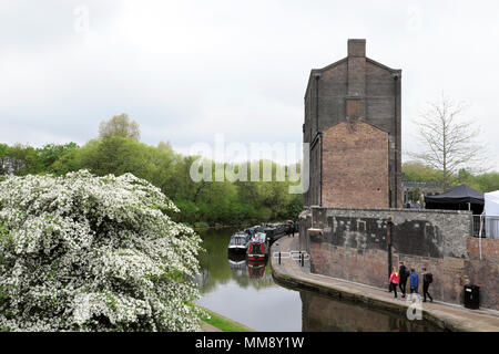 Vertical view of the old Fish and Coal Offices building on Regents Canal in spring Kings Cross, Camden in London N1 England UK    KATHY DEWITT Stock Photo