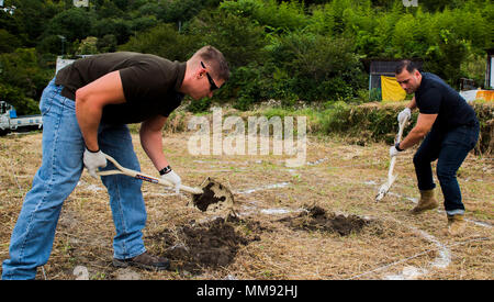 digging a hole to build a pond in a garden in the uk with pond liner ...