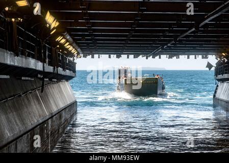 170917-N-WH681-014  CARIBBEAN SEA (Sept. 17, 2017) A landing craft utility carrying service members evacuated from St. Thomas, U.S. Virgin Islands, in anticipation of Hurricane Maria enters the well deck of the amphibious assault ship USS Kearsarge (LHD 3). The Department of Defense is supporting the Federal Emergency Management Agency, the lead federal agency, in helping those affected by Hurricane Irma to minimize suffering and is one component of the overall whole-of-government response effort. (U.S. Navy photo by Mass Communication Specialist 3rd Class Ryre Arciaga/Released) Stock Photo