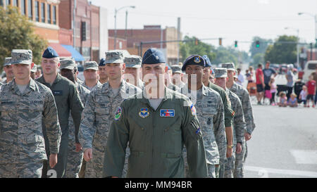 Airmen from the 71st Flying Training Wing march in the Enid's annual Cherokee Strip Celebration parade Sept. 16, 2017, that is held in the downtown Enid, Oklahoma. The festival is a celebration of the founding of the town in 1893. (U.S. Air Force photo by Airman 1st Class Taylor Crul) Stock Photo