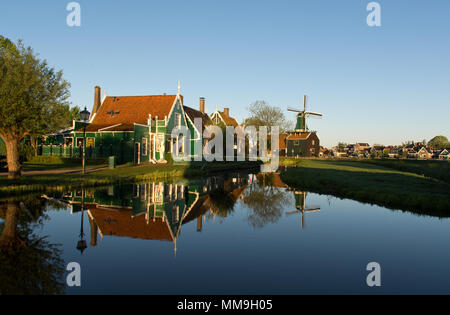 Water reflections in a pond in Zaanse Schans at sunrise, The Netherlands Stock Photo