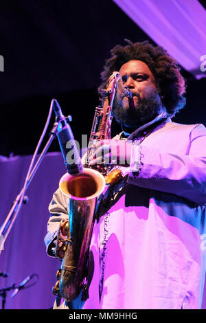 American tenor saxophonist, Kamasi Washington performing at the Cheltenham Jazz Festival, Cheltenham ,UK. May 6, 2018 Stock Photo