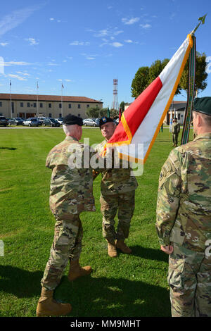 Brig. Gen. Eugene LeBoeuf, acting Command General, U.S. Army Africa, passes the USARAF Colors to Command Sgt. Maj. Jeremiah Inman, USARAF Command Sgt. Maj. during an assumption of responsibility ceremony on Hoekstra Field in Vicenza, Italy, September 20, 2017.   . (U.S. Army Photo by Visual Information Specialist graigg Faggionato/Released) Stock Photo
