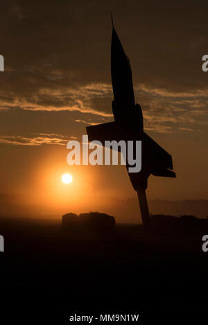 DAYTON, Ohio -- An early morning sunrise with a Lockheed F-104 Starfighter on display in front of the National Museum of the U.S. Air Force on 15 Sep. 2017. The National Museum of the United States Air Force collects, researches, conserves, interprets and presents the Air Force's history, heritage and traditions, as well as today's mission to fly, fight and win ... in Air, Space and Cyberspace to a global audience through engaging exhibits, educational outreach, special programs, and the stewardship of the national historic collection. (U.S. Air Force photo by Ken LaRock) Stock Photo
