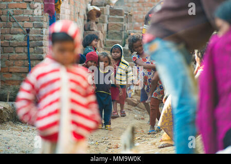 VARANASI - INDIA - 06 JANUARY 2018. A group of poor children is playing in the narrow alleys of Varanasi, India. Varanasi also known as Benares is a m Stock Photo