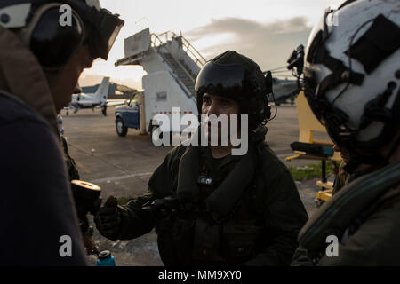 170924-N-AY374-126 SAN JUAN, Puerto Rico (Sept. 24, 2017) Marine Sgt. Andrew Mucarski, assigned to the 26th Marine Expeditionary Unit, gives a safety brief to service members boarding a CH-53E Super Stallion returning to the amphibious assault ship USS Kearsarge (LHD 3). Kearsarge and the 26th MEU are assisting with relief efforts in the aftermath of Hurricane Maria. The Department of Defense is supporting the Federal Emergency Management Agency, the lead federal agency, in helping those affected by Hurricane Maria to minimize suffering and is one component of the overall whole-of-government r Stock Photo