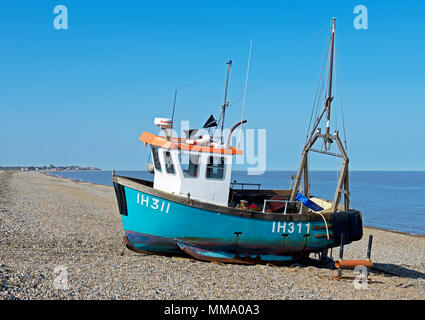 Fishing boat on the shingle beach at Aldeburgh, Suffolk, England UK Stock Photo