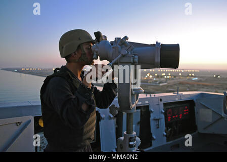 170917-N-RC734-046 SUEZ CANAL (Sept. 17, 2017) - Seaman Recruit Joshua Dineros, from San Jose, California, stands lookout watch as the San Antonio-class amphibious transport dock ship USS San Diego (LPD 22) transits the Suez Canal Sept. 17, 2017. San Diego is deployed with the America Amphibious Ready Group and the 15th Marine Expeditionary Unit to support maritime security operations and security cooperation efforts in the U.S. 6th Fleet area of operations. (U.S. Navy photo by Chief Mass Communication Specialist Joseph M. Buliavac/Released) Stock Photo