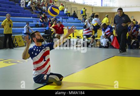 Army veteran Stefan Leroy, a former sergeant from Santa Rosa, Calif., practices serving drills during sitting volleyball preliminaries for the 2017 Invictus Games at the Pan Am Sports Centre in Toronto, Canada, Sept. 26, 2017. Leroy was injured when an improvised explosive device detonated June 7, 2012, causing him to lose both legs. (U.S. Air Force photo by Staff Sgt. Alexx Pons) Stock Photo