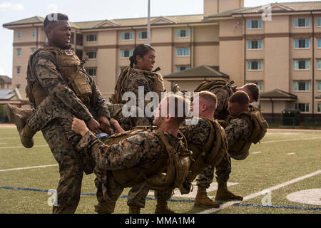 U.S. Marines conduct buddy sit ups during a Martial Arts