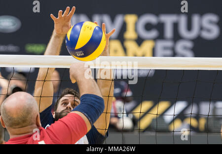 Athletes compete in Sitting Volleyball at the Mattamy Athletics Center during the 2017 Invictus Games in Toronto on September 27, 2017. The Invictus Games, established by Prince Harry in 2014, brings together wounded and injured veterans from 17 nations for 12 adaptive sporting events, including track and field, wheelchair basketball, wheelchair rugby, swimming, sitting volleyball, and new to the 2017 games, golf.    (DoD photo by Roger L. Wollenberg) Stock Photo