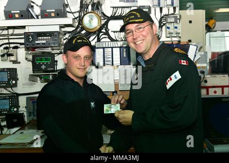 The Royal Canadian Navy minesweeper HMCS KINGSTON (MM700) approaching ...