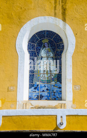 Colonial building painted with the Vatican colors of yellow and white located in Mexico. Stock Photo