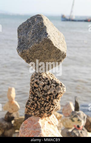 stones balanced on the seashore Stock Photo