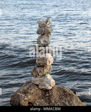 stones balanced on the seashore Stock Photo