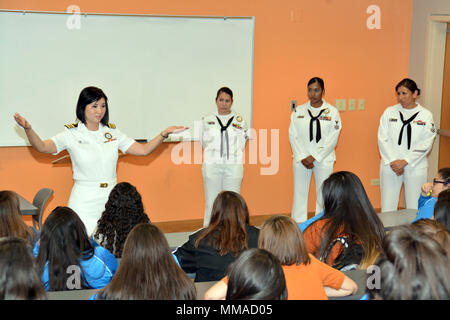 EDINBURG, Texas - (Oct. 4, 2017) Houston native, Lt. Cmdr. Diana Tran-Yu, Navy City Outreach Southwest Region officer, Navy Recruiting Command, along with recruiters assigned to Navy Recruiting District San Antonio, discusses grassroots perspectives on opportunities, benefits, and careers in the Navy to students during Latina Day at the 2017 Hispanic Engineering, Science and Technology Week (HESTEC) held on the campus of the University of Texas-Rio Grande Valley.  HESTEC is a nationally recognized model for promoting STEM careers to students of all ages.  Now in its 16th year, the program has  Stock Photo