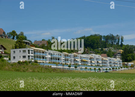 Apartment building on the coutryside in switzerland Stock Photo