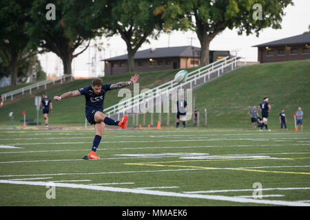 A Royal Sailor assigned to the Royal Navy Rugby Team kicks the ball during an exhibition game between the All Marine Rugby Team and Royal Navy Rugby Team at Butler Stadium on Marine Corps Base Quantico, Va., Sept. 20, 2017. The match was a part of the Royal Navy Rugby Union Senior XV Tour, which consisted of matches against the United States Naval Academy and the Potomac Rugby Club. (U.S. Marine Corps photo by Lance Cpl. Cristian L. Ricardo) Stock Photo