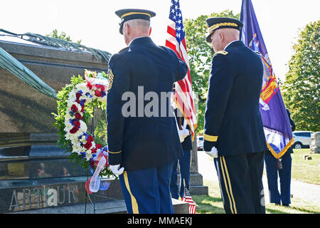 Major General Raymond Shields, commander of the New York Army National Guard; right, and New York Army National Guard Command Sgt. Major David Piwowarski salute after placing a wreath at the grave of Chester A. Arrthur, president of the United States from 1881 to 1885 during a ceremony in Albany Rural Cemetery in Menands, N.Y. on Oct. 5, 2017 . The United States Military honors deceased presidents with a wreath from the sitting president at their gravesite on the anniversary of the past president's birth. ( New York State Division of Military and Naval Affairs photo by William Albrecht) Stock Photo