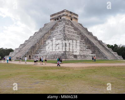 CHICHEN ITZA, MEXICO NORTH AMERICA on FEBRUARY 2018: Great pyramid and tourists in mayan town, ruins at archaeological sites landscapes with tourists  Stock Photo