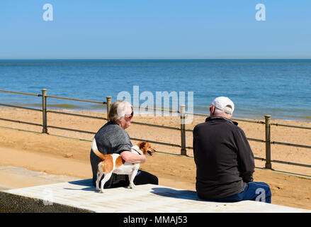 Middle aged couple looking out to sea on a warm sunny day, Ramsgate promenade, UK Stock Photo