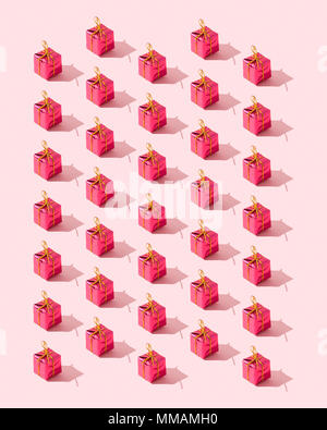 Small gift boxes organized over pink background Stock Photo