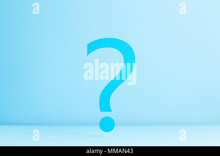 Question mark over blue background Stock Photo
