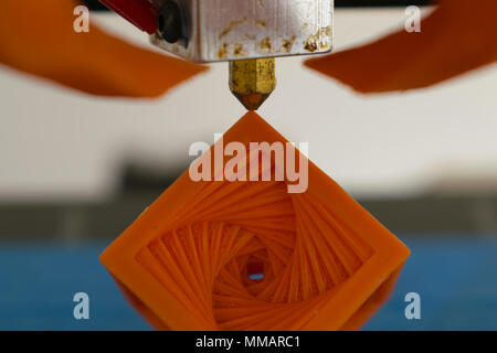 3d printer hot-end nozzle with printed object concept Stock Photo
