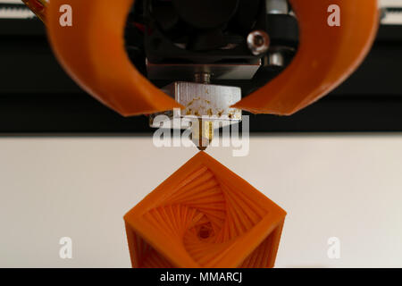 3d printer hot-end nozzle with printed object concept Stock Photo
