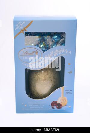 Lindt white chocolate Easter egg in box on neutral background Stock Photo
