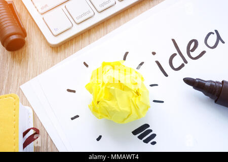 Yellow paper like a bulb as an idea concept. Inspiration. Stock Photo