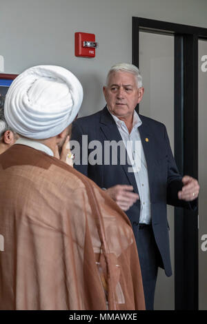 Lansing, Michigan - Imam Mohammad Ali Elahi speaks with Republican State Senator Ken Horn during the annual Michigan Muslim Capitol Day at the state c Stock Photo