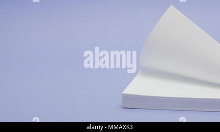 Blank note papers label with clip on purple background. Stock Photo