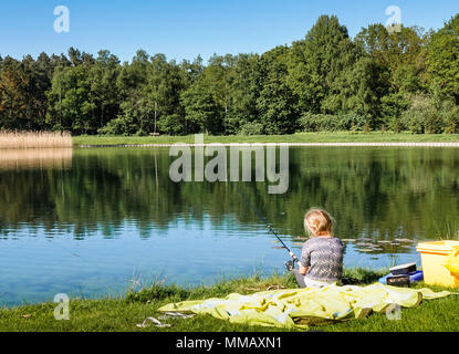 Family fishing on the pond